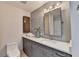 Bathroom with grey vanity and modern finishes, including light tile and stainless hardware at 945 Tiber Cir, Alpharetta, GA 30022