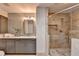 Modern bathroom featuring a glass shower, gray vanity with white countertop, and light tile backsplash at 945 Tiber Cir, Alpharetta, GA 30022