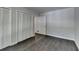 Bedroom with hardwood floors features spacious closet at 945 Tiber Cir, Alpharetta, GA 30022