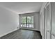 Bright bedroom with closet and large window overlooking lush greenery at 945 Tiber Cir, Alpharetta, GA 30022
