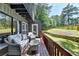 Inviting outdoor deck with comfortable seating and views of the fenced backyard at 945 Tiber Cir, Alpharetta, GA 30022