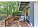 Cozy outdoor deck with relaxing chair and views of backyard at 945 Tiber Cir, Alpharetta, GA 30022