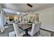 Dining area open to living spaces with a seamless flow, perfect for modern living and entertaining at 945 Tiber Cir, Alpharetta, GA 30022