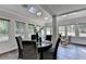 Bright dining room with skylights and large windows overlooks backyard at 945 Tiber Cir, Alpharetta, GA 30022