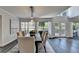 Open dining area with vaulted ceilings, hardwood floors, and large windows, ideal for entertaining and Gathering at 945 Tiber Cir, Alpharetta, GA 30022