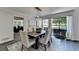 This dining room features a rustic table, stylish chairs, and pendant lighting for a modern touch at 945 Tiber Cir, Alpharetta, GA 30022
