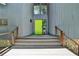 Front entrance with stairs and metal railings leading up to a modern home with a green front door at 945 Tiber Cir, Alpharetta, GA 30022