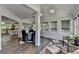 Open-concept living space with sunroom and dining room off of kitchen at 945 Tiber Cir, Alpharetta, GA 30022