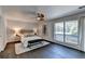 Main bedroom with ceiling fan and large window at 945 Tiber Cir, Alpharetta, GA 30022
