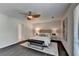 Main bedroom featuring decorative ceiling fan and large window at 945 Tiber Cir, Alpharetta, GA 30022