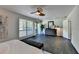 Main bedroom with hardwood floors, large window, and access to balcony at 945 Tiber Cir, Alpharetta, GA 30022