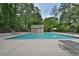 Enjoy a refreshing swim in the community pool surrounded by a privacy fence and mature trees at 945 Tiber Cir, Alpharetta, GA 30022