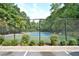 Well maintained tennis court available for residents, surrounded by trees for added privacy at 945 Tiber Cir, Alpharetta, GA 30022