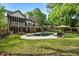 Beautiful backyard featuring a pool, patio, mature trees, and outdoor seating at 1556 Gaylor Se Dr, Smyrna, GA 30082