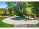 Enjoy the backyard pool with the mature trees offering an outdoor oasis for relaxation and entertainment at 1556 Gaylor Se Dr, Smyrna, GA 30082