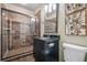 Bathroom featuring a glass enclosed shower, black granite vanity and tile flooring at 1556 Gaylor Se Dr, Smyrna, GA 30082