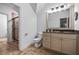 Bathroom featuring granite counters, tile floors, and a glass enclosed shower at 1556 Gaylor Se Dr, Smyrna, GA 30082