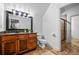 Bathroom featuring wooden cabinets and a glass enclosed shower at 1556 Gaylor Se Dr, Smyrna, GA 30082