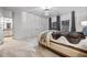 Elegant bedroom featuring neutral walls, plush carpet, and a stylish light fixture at 1556 Gaylor Se Dr, Smyrna, GA 30082