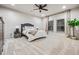 Spacious carpeted bedroom with a ceiling fan and ample natural light from the many windows at 1556 Gaylor Se Dr, Smyrna, GA 30082