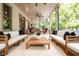Spacious covered patio provides a perfect outdoor retreat, complete with stylish seating and lush greenery at 1556 Gaylor Se Dr, Smyrna, GA 30082