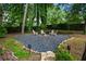 Relax around the cozy fire pit area, set within a secluded, beautifully landscaped backyard at 1556 Gaylor Se Dr, Smyrna, GA 30082