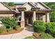 Inviting front porch with stone accents and lush landscaping, offering great curb appeal at 1556 Gaylor Se Dr, Smyrna, GA 30082