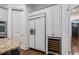 Custom kitchen includes built-in refrigerator, wine storage, and stainless steel appliances at 1556 Gaylor Se Dr, Smyrna, GA 30082