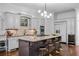 Well-equipped kitchen with a spacious island, stylish countertops, and modern appliances, including a wine fridge at 1556 Gaylor Se Dr, Smyrna, GA 30082