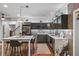 Modern kitchen featuring granite countertops, stainless steel appliances, and island seating at 1556 Gaylor Se Dr, Smyrna, GA 30082