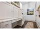 Well-organized laundry room featuring custom cabinets, ample storage, and a convenient folding area at 1556 Gaylor Se Dr, Smyrna, GA 30082