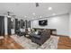 Carpeted living room with large screen tv and two sofas at 1556 Gaylor Se Dr, Smyrna, GA 30082