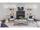 Bright living room features a black fireplace, custom built-ins, and a modern area rug at 1556 Gaylor Se Dr, Smyrna, GA 30082