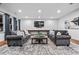 Comfortable living room with large sofas, a decorative rug, recessed lighting, and a mounted television at 1556 Gaylor Se Dr, Smyrna, GA 30082