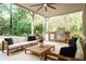 Enjoy outdoor living on the covered patio with a fully-equipped kitchen and ample seating area at 1556 Gaylor Se Dr, Smyrna, GA 30082