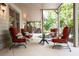 Inviting covered patio with comfortable seating arrangements perfect for relaxing and enjoying the outdoor ambiance at 1556 Gaylor Se Dr, Smyrna, GA 30082
