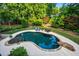 Inviting in-ground pool surrounded by lush landscaping and lounge chairs at 1556 Gaylor Se Dr, Smyrna, GA 30082
