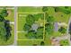 An aerial view of a property on .89 acres with mature trees and surrounding neighborhood at 1605 Saddlecreek Rd, Auburn, GA 30011