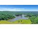 A beautiful aerial view of a lakeside park surrounded by lush greenery at 1605 Saddlecreek Rd, Auburn, GA 30011