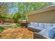 This outdoor living space features a deck with a built-in seating area and a grill at 1605 Saddlecreek Rd, Auburn, GA 30011