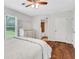 Bedroom featuring hardwood floors, modern furnishings, and lots of natural light at 1605 Saddlecreek Rd, Auburn, GA 30011