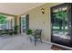 Inviting front porch with swing, seating and a decorative wreath on the front door at 1605 Saddlecreek Rd, Auburn, GA 30011