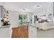 Bright kitchen with hardwood floors, a dining area and modern appliances at 1605 Saddlecreek Rd, Auburn, GA 30011