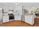 Charming kitchen with modern stainless steel appliances, granite countertops and hardwood flooring at 1605 Saddlecreek Rd, Auburn, GA 30011