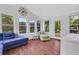 Bright sunroom with hardwood floors and access to a backyard at 1605 Saddlecreek Rd, Auburn, GA 30011