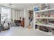 Unfinished basement space with desk, storage shelving, and walk out door at 1668 Macy Ln, Lawrenceville, GA 30043