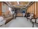 Unfinished basement space with furniture, exposed ductwork, and lighting at 1668 Macy Ln, Lawrenceville, GA 30043