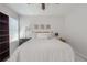 Bedroom features plush bedding, carpet, natural light, and an open bookshelf at 1668 Macy Ln, Lawrenceville, GA 30043