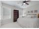 Bedroom with carpet, ceiling fan, natural light, and bookshelf at 1668 Macy Ln, Lawrenceville, GA 30043