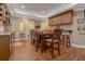 Bright dining area featuring hardwood floors, a wooden table set, and neutral decor at 1668 Macy Ln, Lawrenceville, GA 30043